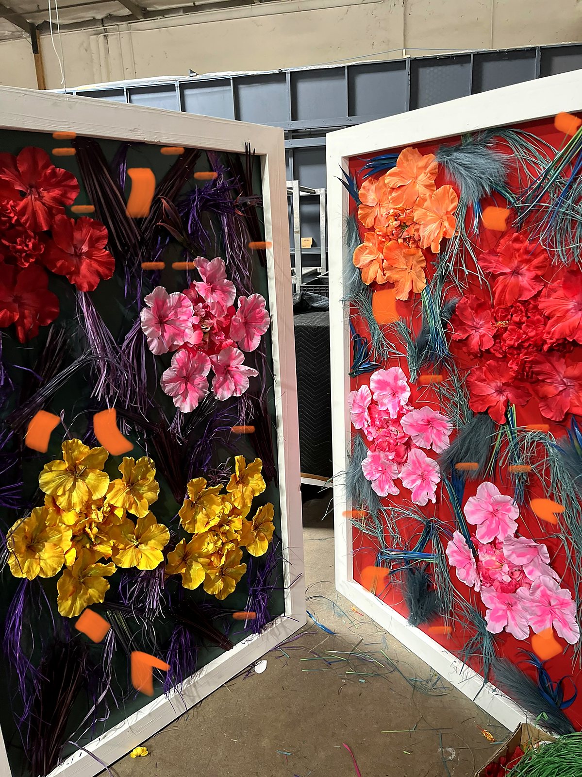 Custom artificial flower wall panels with oversized blooms in red, pink, yellow and orange at the Flour LA studio